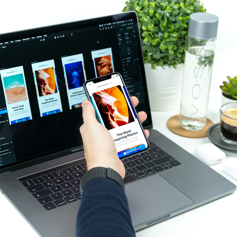 Designer reviewing a modern web interface on screen